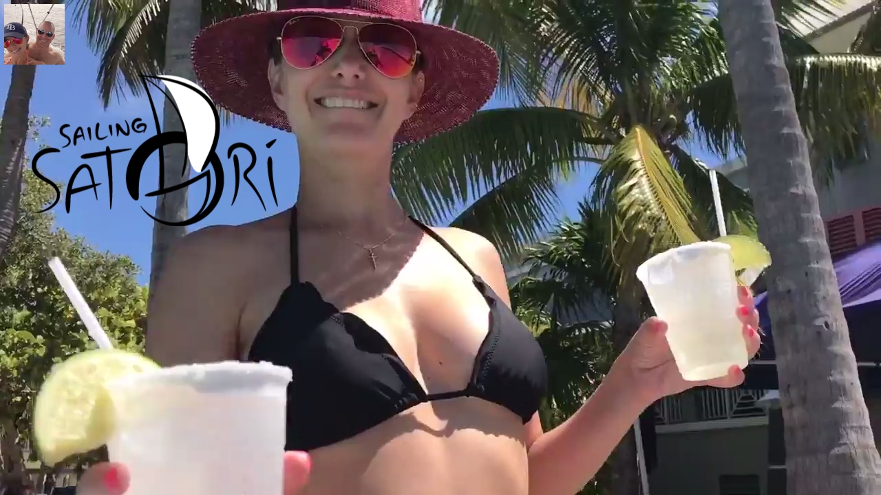Picture of Kelly in a bikini holding two margaritas