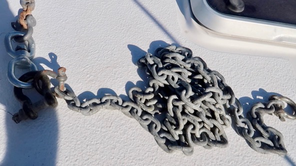 Photo of chain laid on the deck of boat