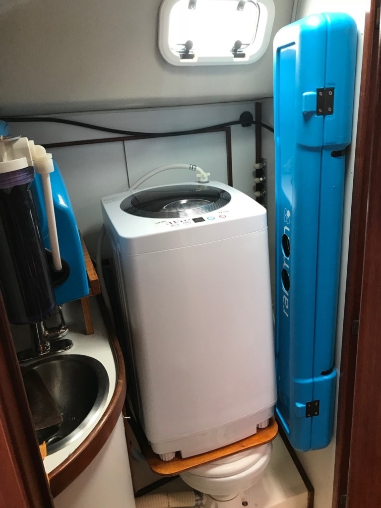 picture of rainman watermaker and washing machine installed in a sailboat bathroom 