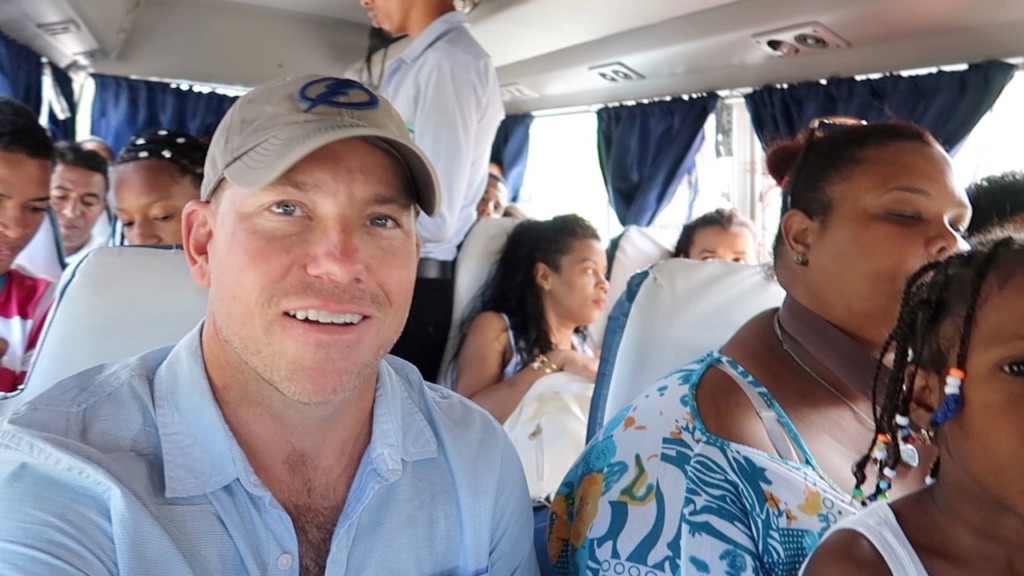 Picture of man on crowded bus in the Dominican Republic 