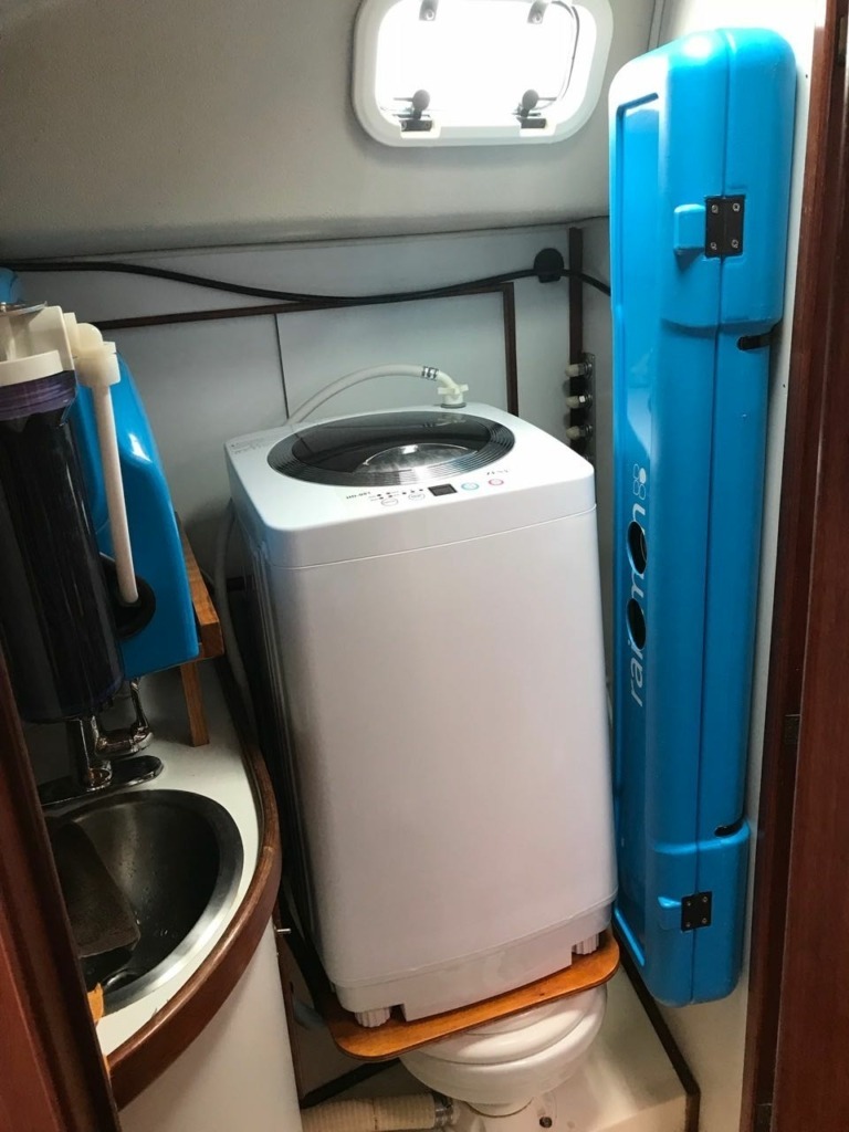 sailboat bathroom converted to a water maker and laundry room