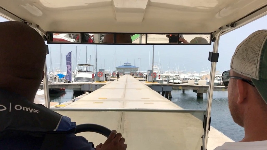 Puerto Del Rey Marina Review - view from inside golf cart shuttle sailing satori